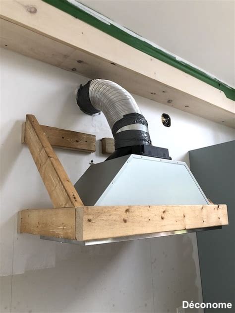 Schéma d'une sortie de hotte mal isolée en combles