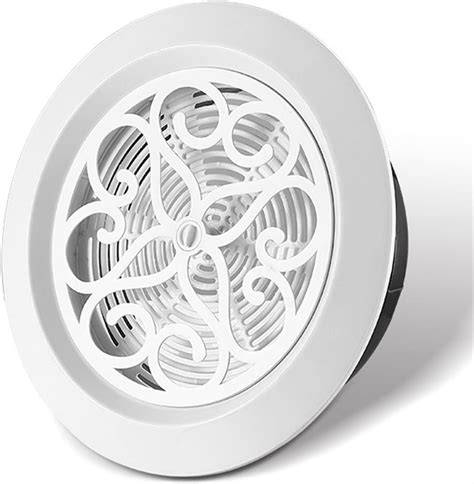 Grille d'aération ronde en bois dans un mur