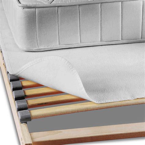 Vue en coupe d'un tapis aérateur sous un matelas