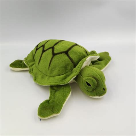 Une peluche tortue verte et bleue réversible