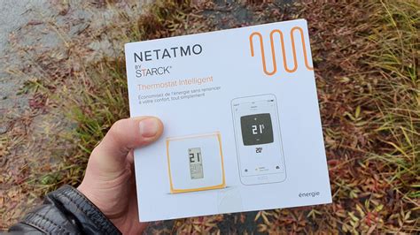 Thermostat connecté Netatmo sur un mur