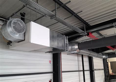 Installation d'un aérotherme fixe Intuis dans un grand entrepôt
